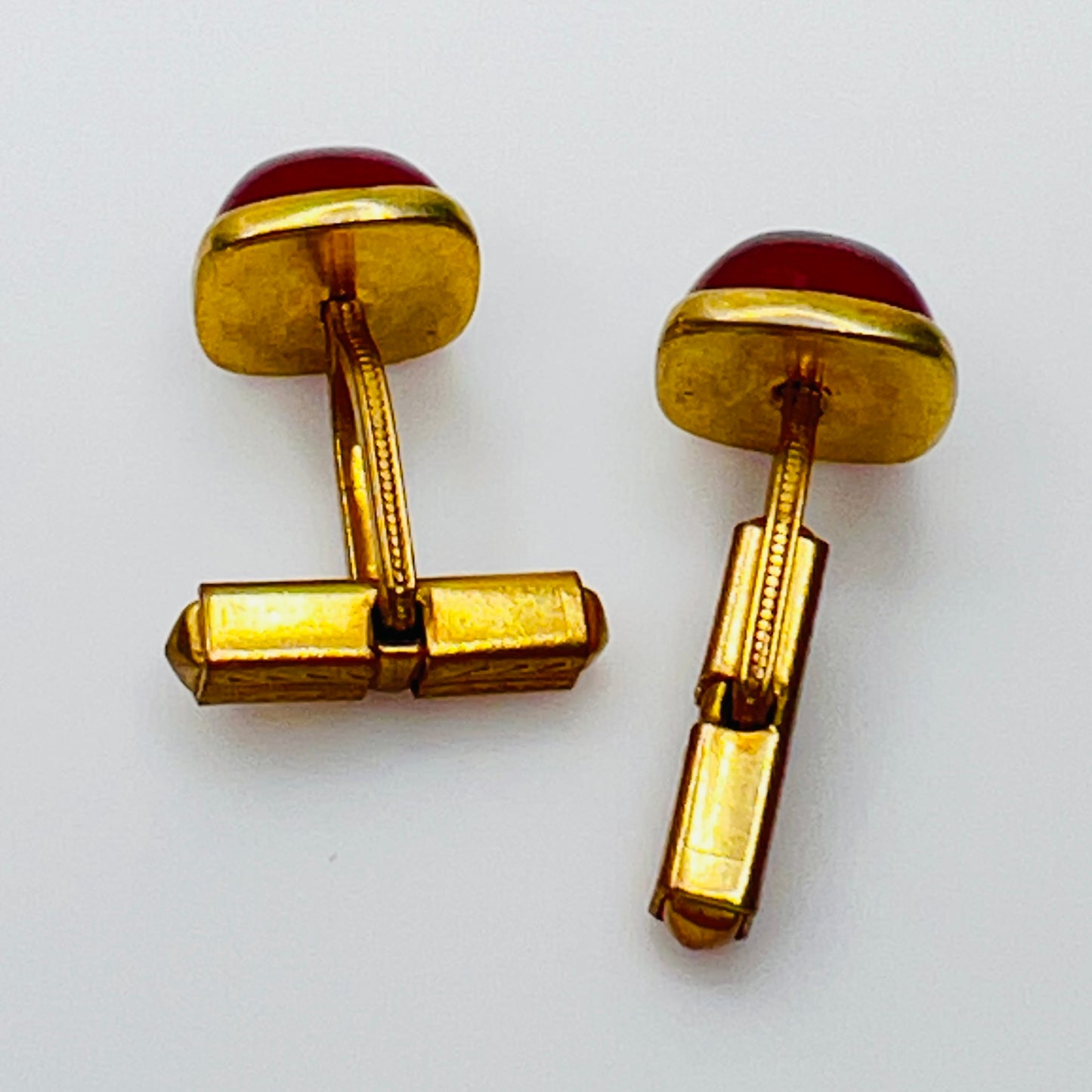 Art Deco estate cufflinks and button studs with square red lucite cabochons