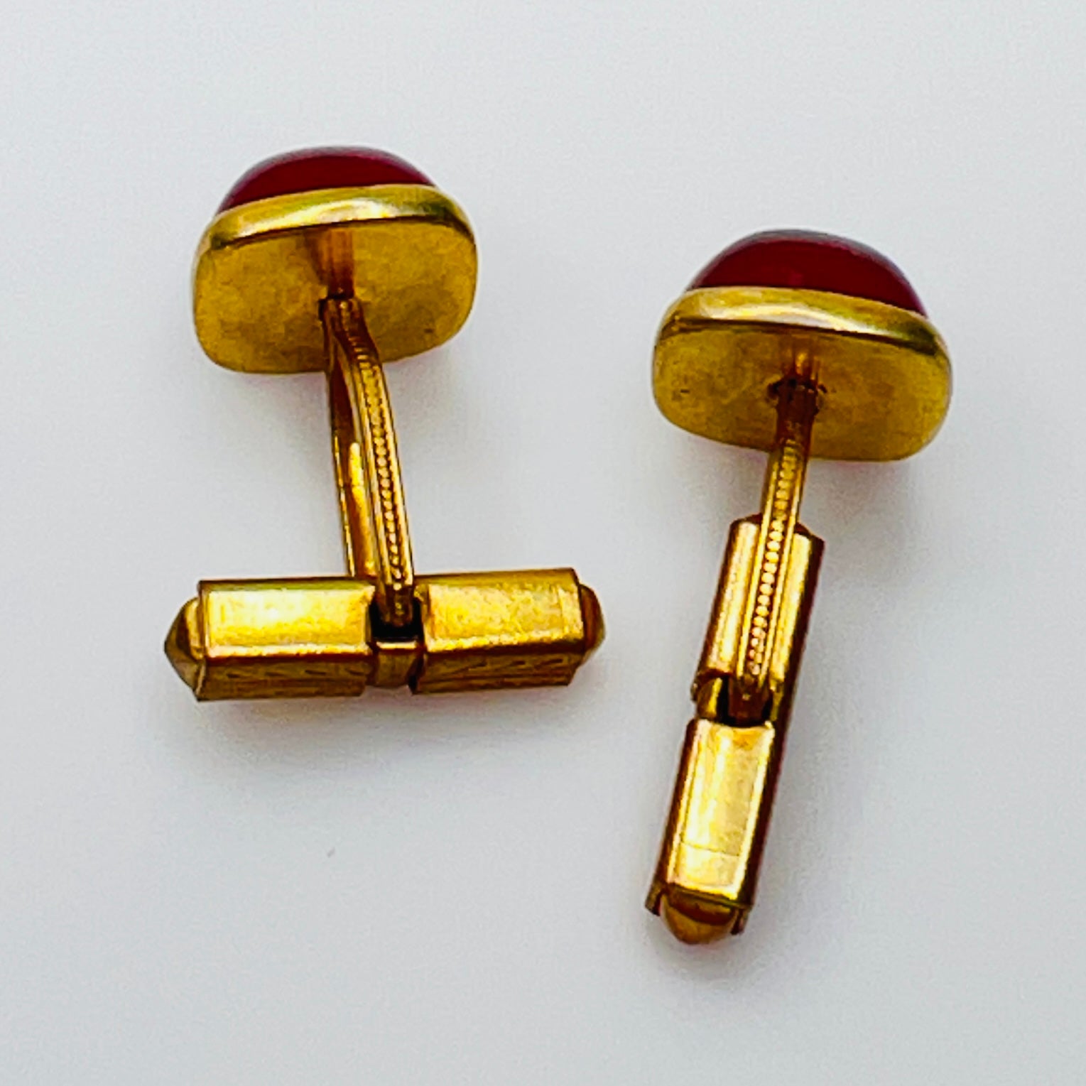 Art Deco estate cufflinks and button studs with square red lucite cabochons