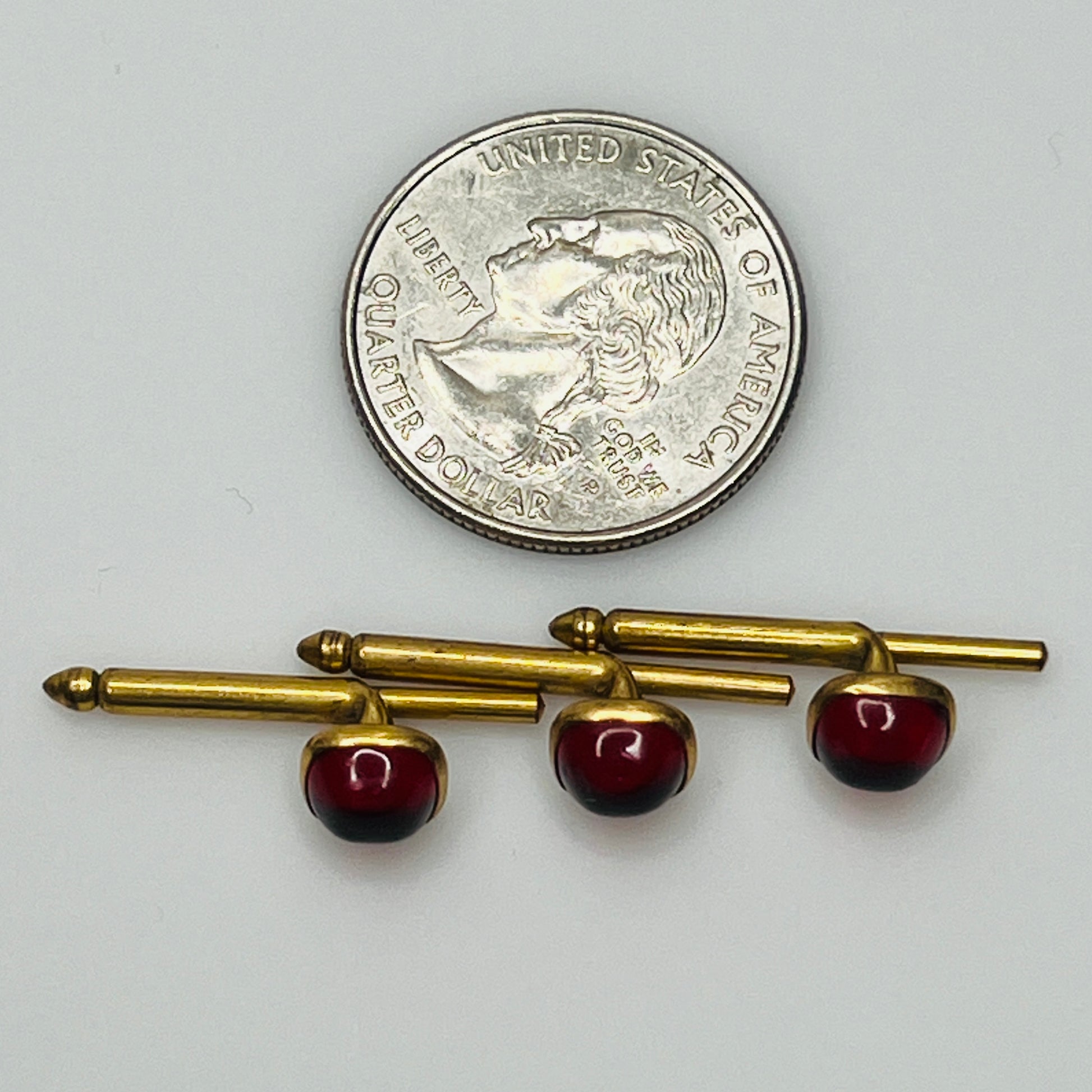 1940s ruby red lucite studs in brass
