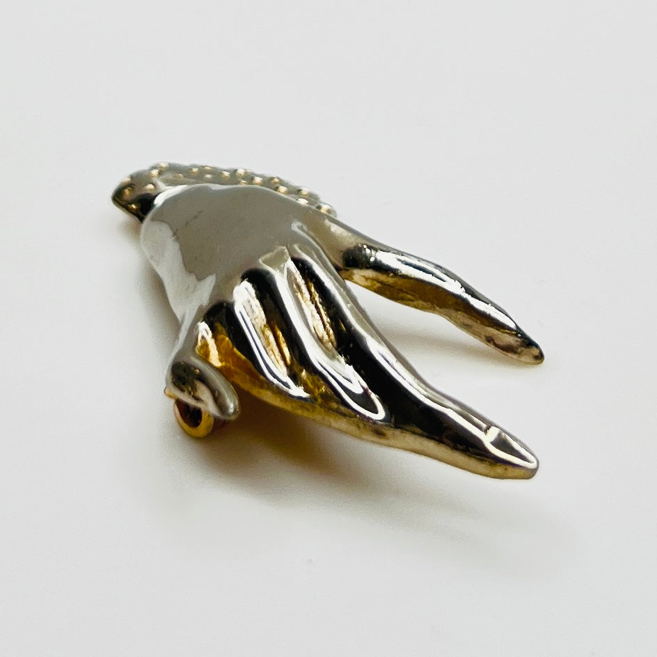 Vintage modernist hand brooch with polished finish