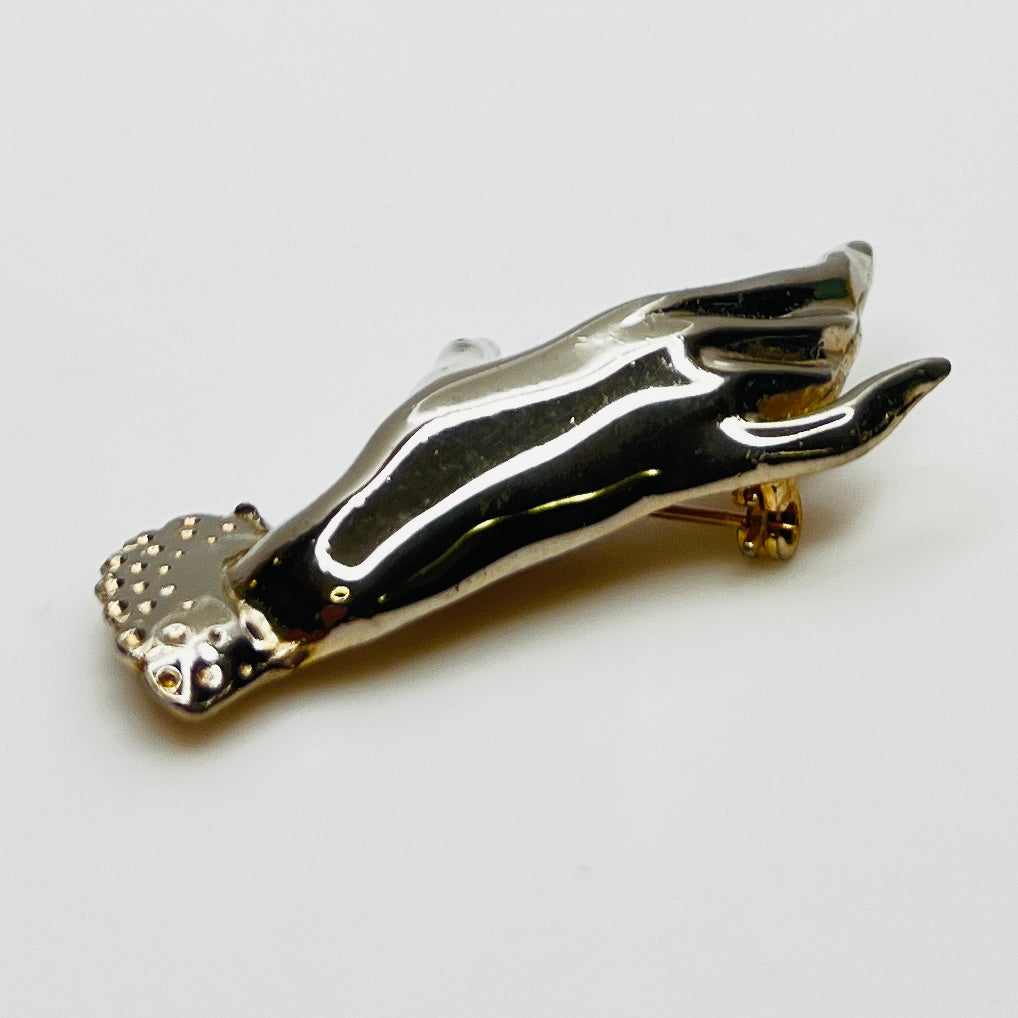 Vintage modernist hand brooch with polished finish