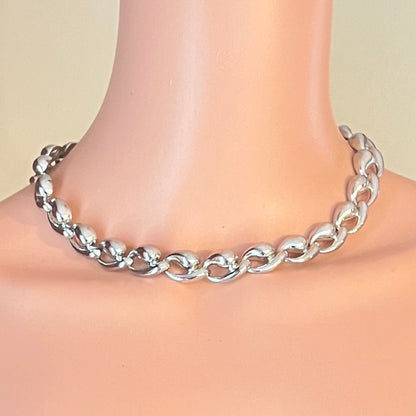 Vintage mid century silver collar necklace shown on mannequin