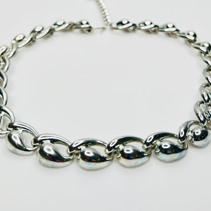 Close up detail of vintage mid century silver sculptural links