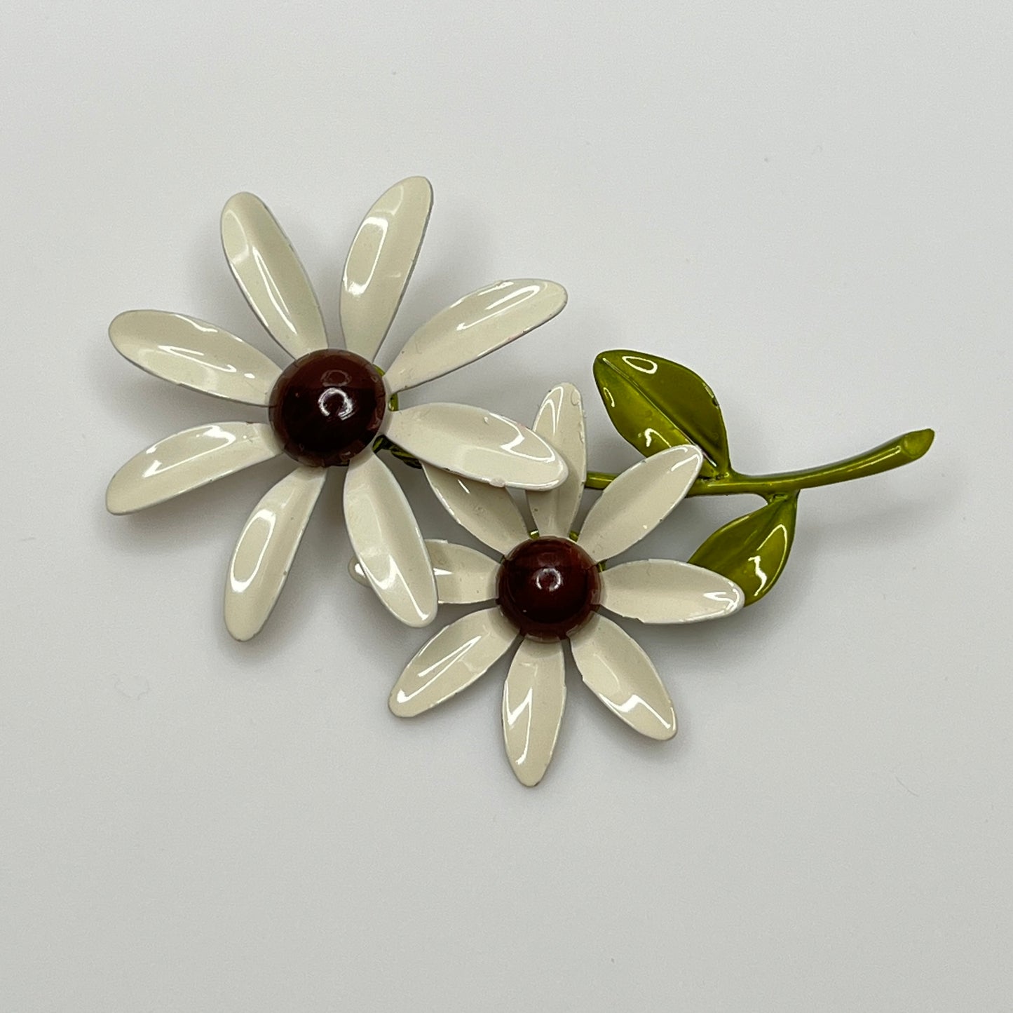 1960s enamel flower power jewelry set with green leaf detail