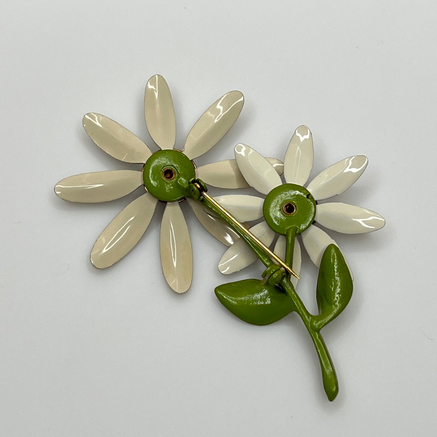 1960s enamel flower power jewelry set with green leaf detail
