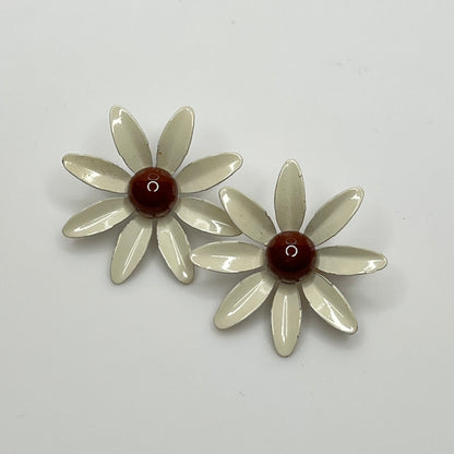 Clip-on enamel daisy earrings with white petals and brown centers