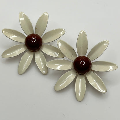 Clip-on enamel daisy earrings with white petals and brown centers
