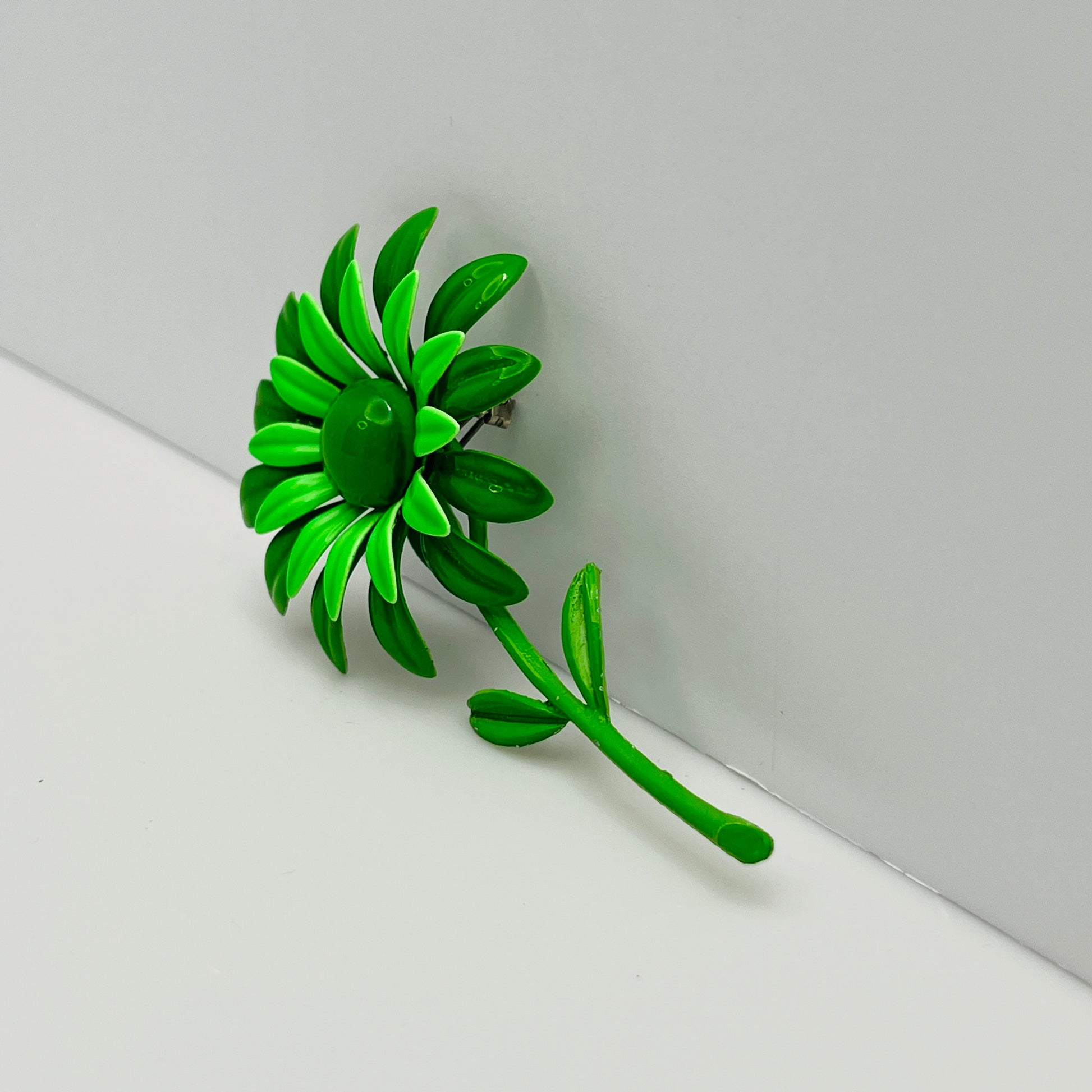 Large green enamel flower brooch with stem and leaves, 1960s