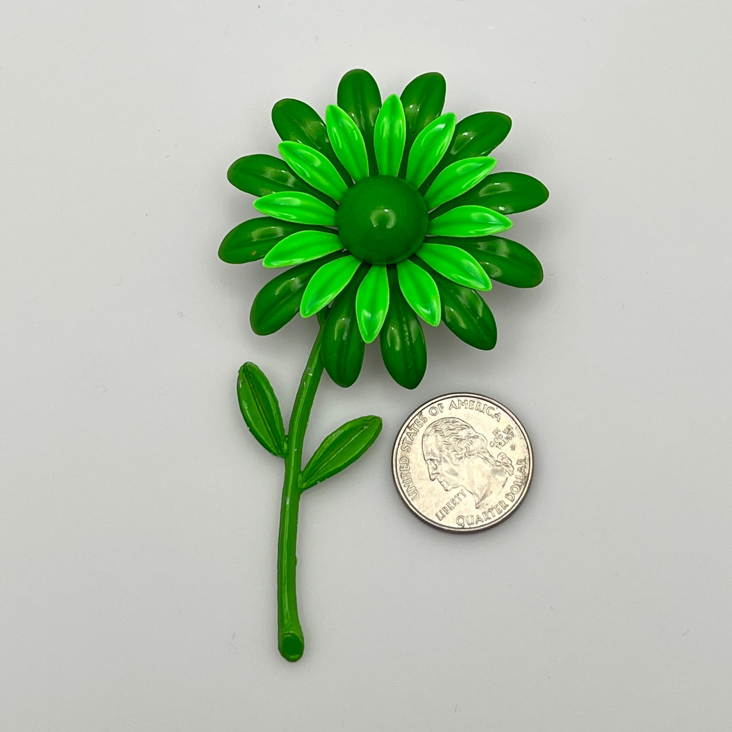Large green enamel flower brooch with stem and leaves, 1960s