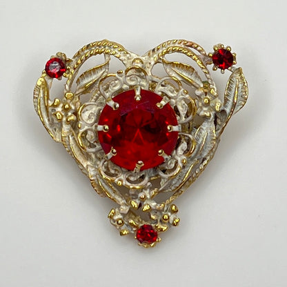 1960s heart-shaped brooch with red rhinestone and white enamel