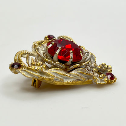 1960s heart-shaped brooch with red rhinestone and white enamel
