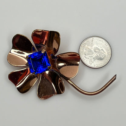 Vintage brooch with quarter for scale showing size and shape