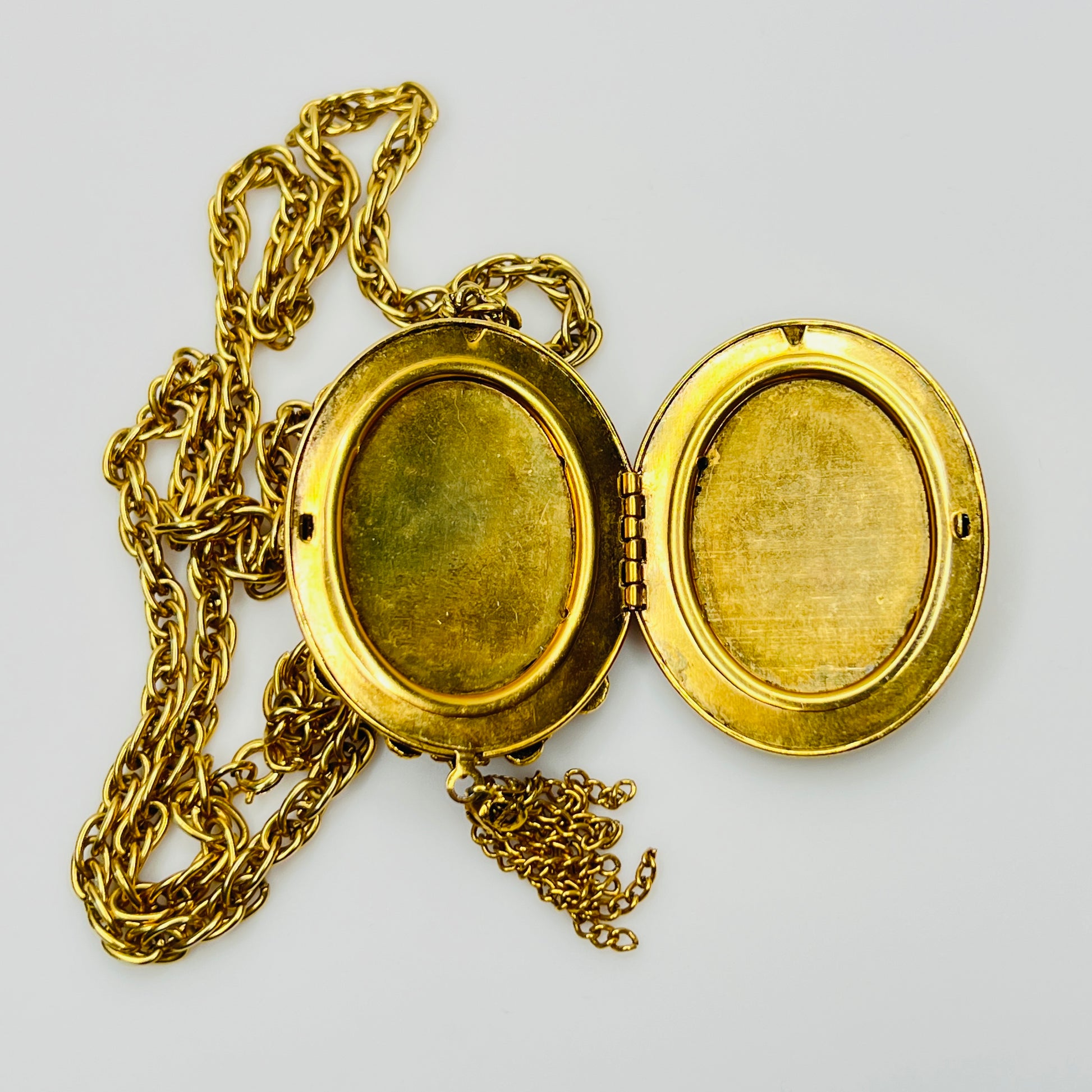 Open oval locket interior with hinged design