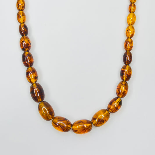 Marbled amber Lucite bead necklace with warm honey tones