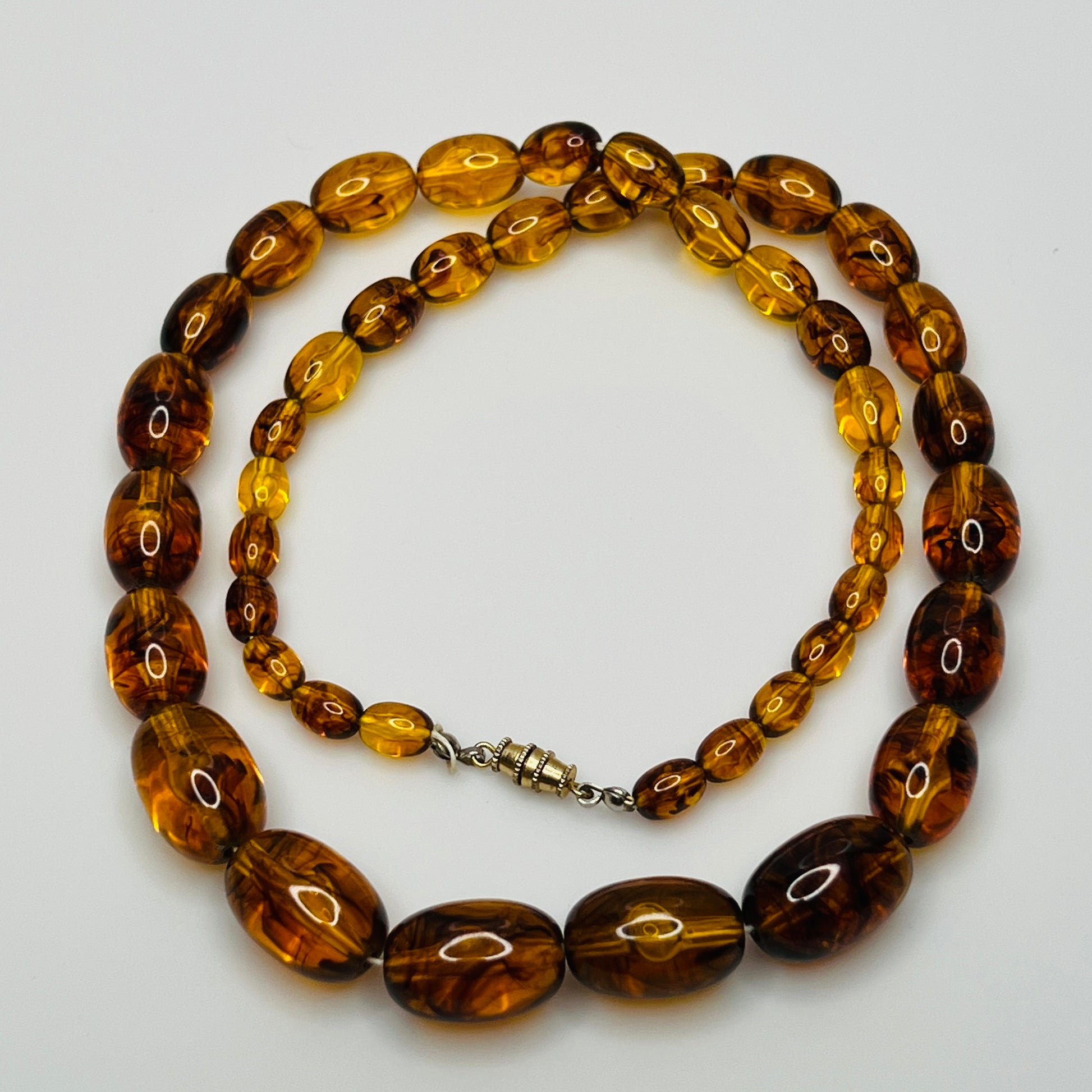 Marbled amber Lucite bead necklace with warm honey tones