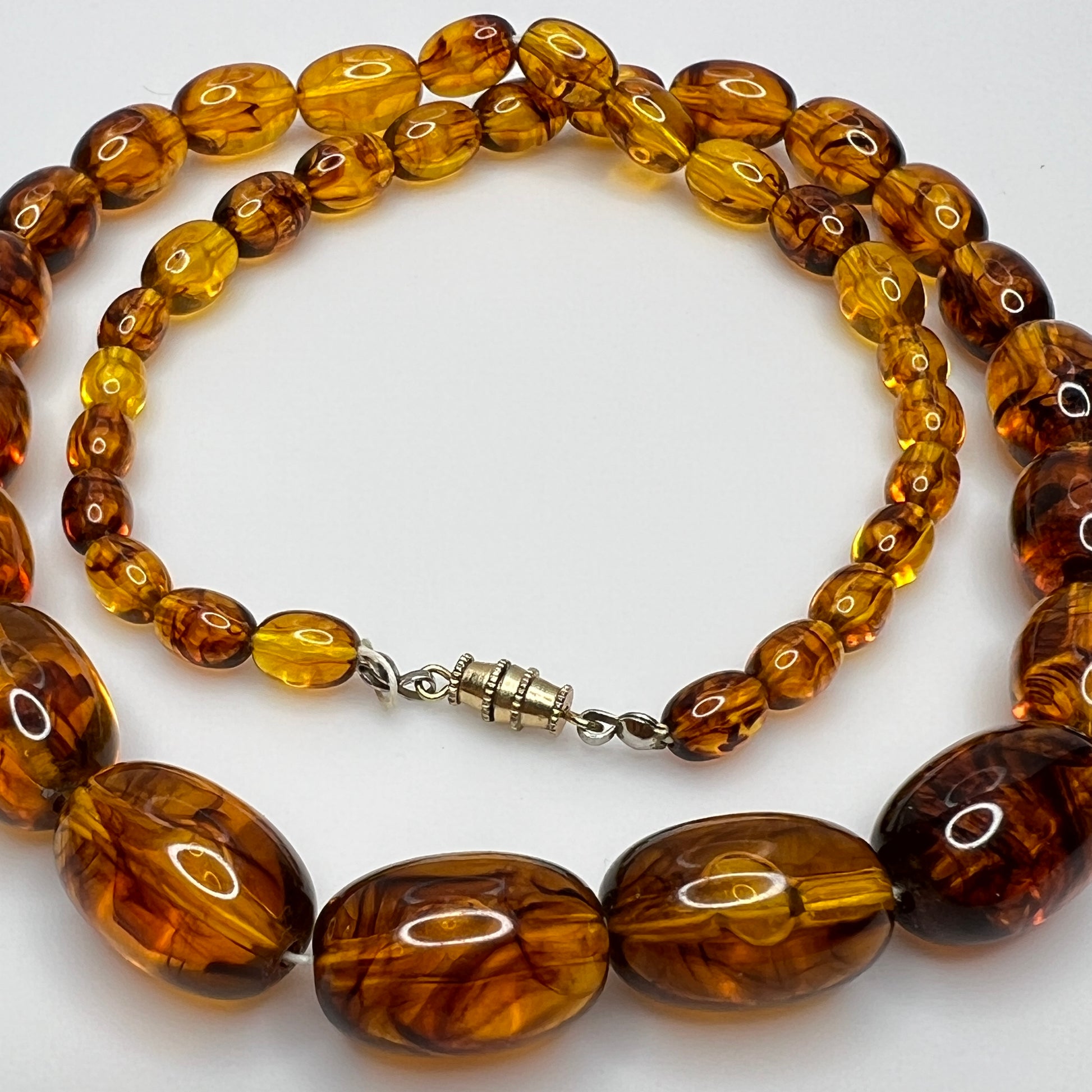 Marbled amber Lucite bead necklace with warm honey tones