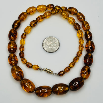Marbled amber Lucite bead necklace with warm honey tones