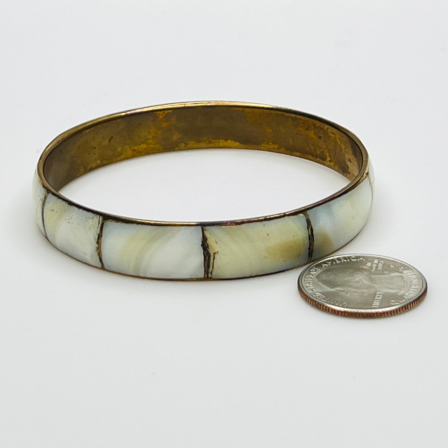 Boho vintage bangle with natural shell inlay, laid flat