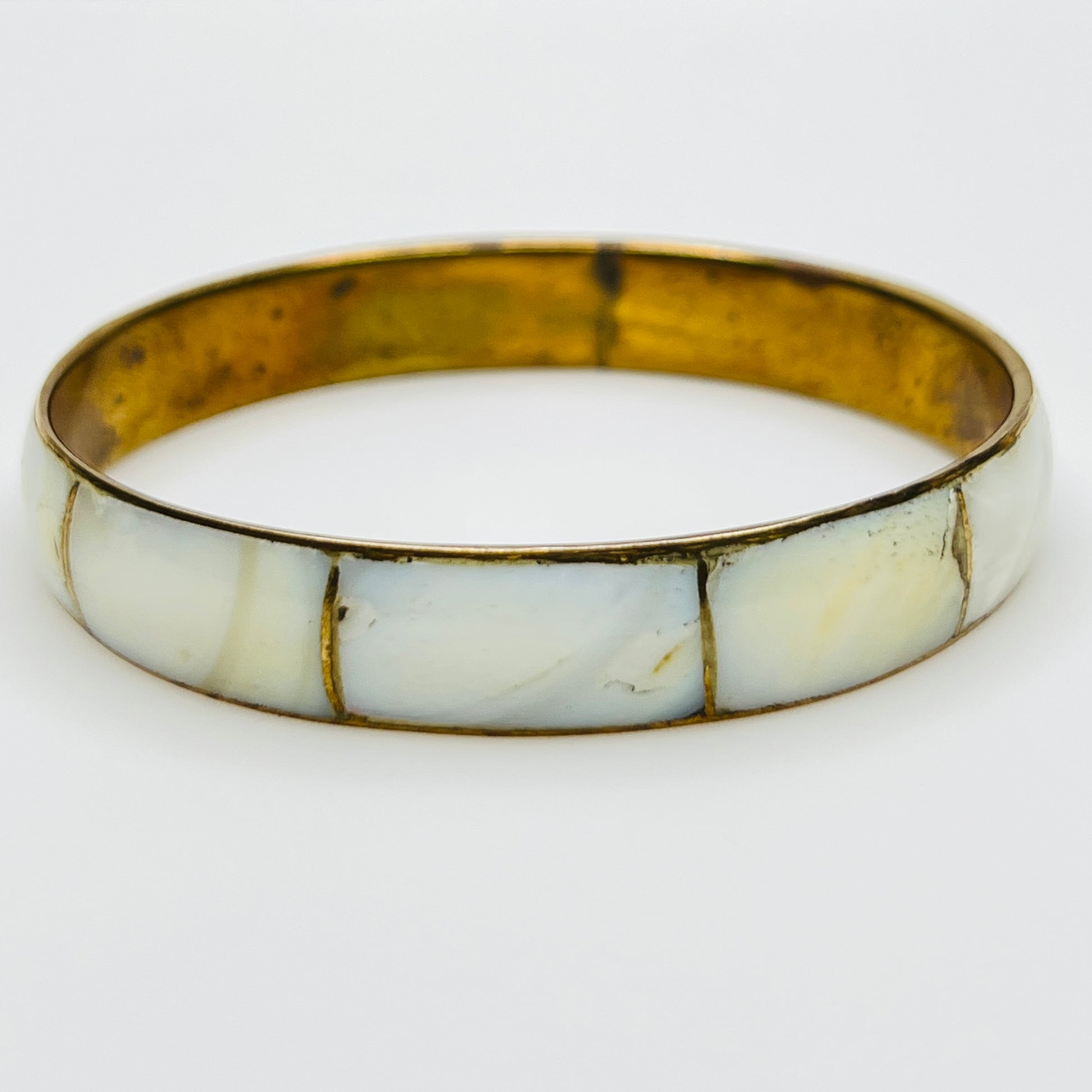 Boho vintage bangle with natural shell inlay, laid flat