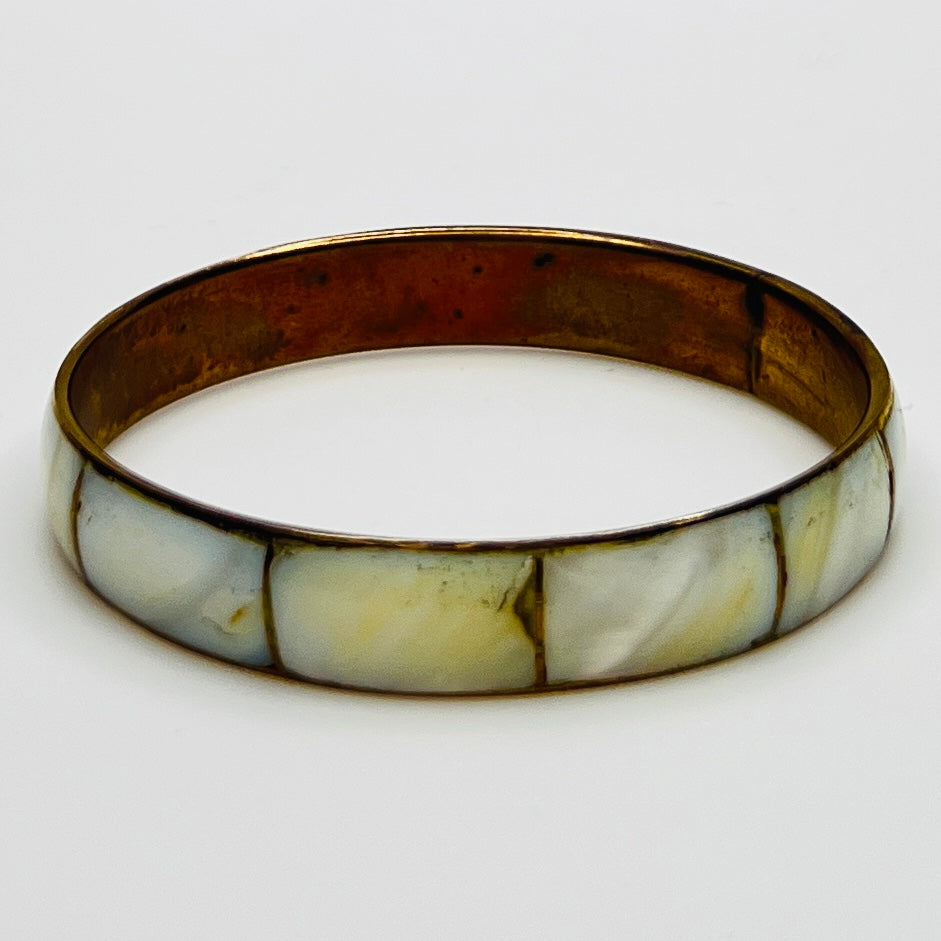 Boho vintage bangle with natural shell inlay, laid flat