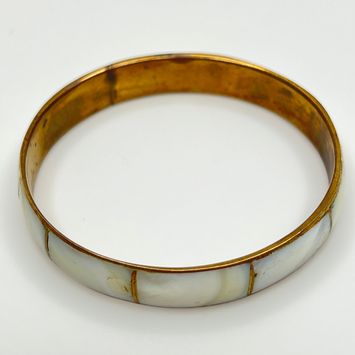 Boho vintage bangle with natural shell inlay, laid flat