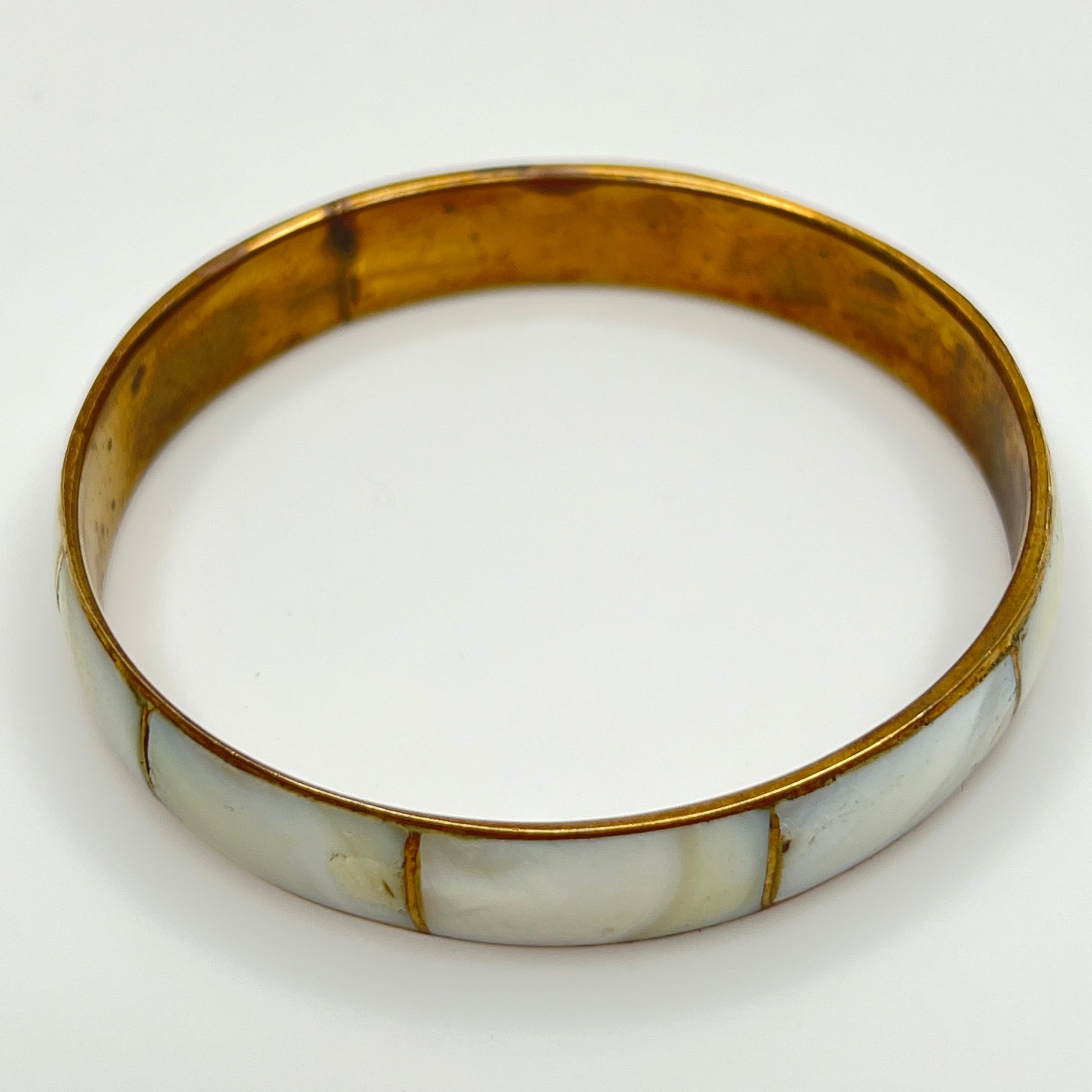 Boho vintage bangle with natural shell inlay, laid flat