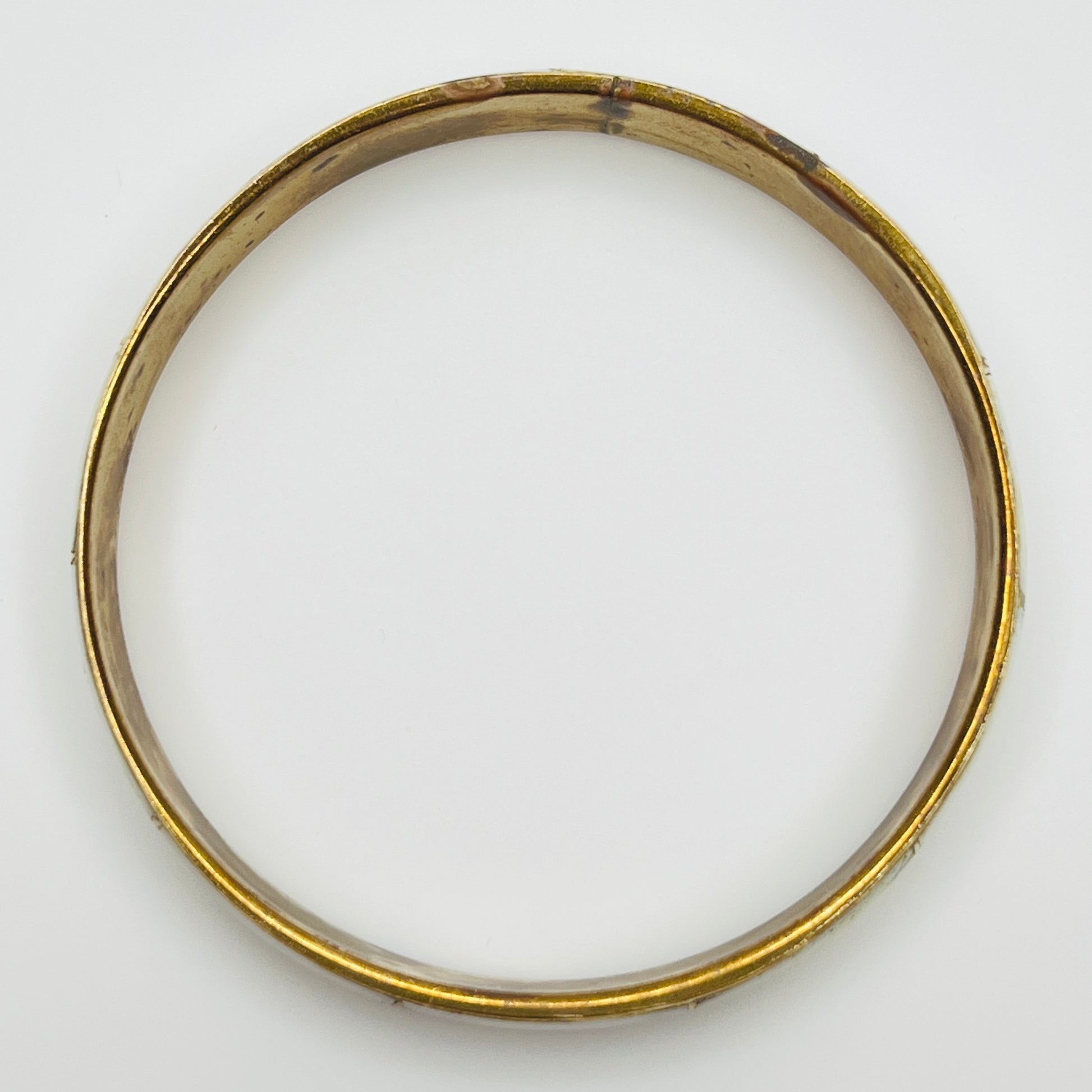 Boho vintage bangle with natural shell inlay, laid flat