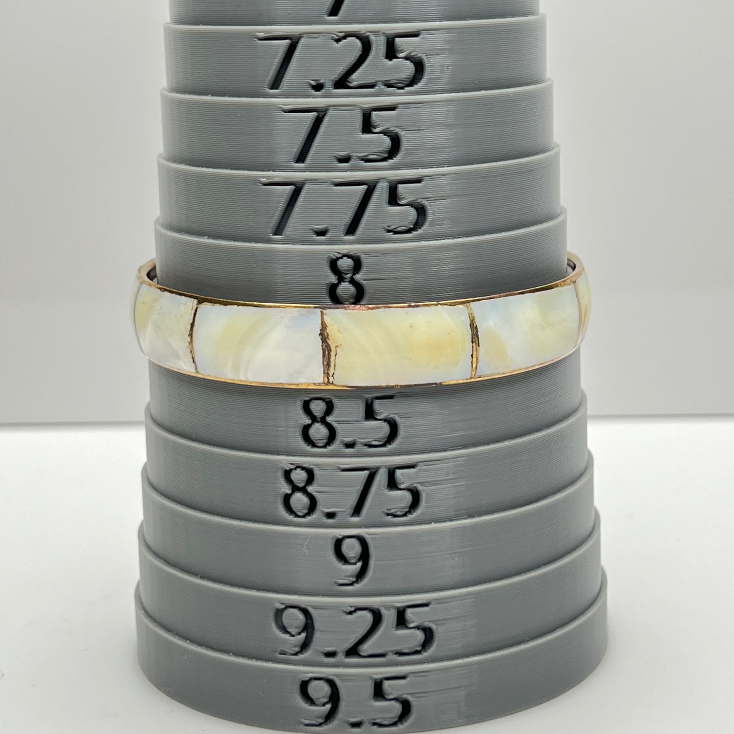 Bracelet shown on sizing mandrel at 8.25 inches interior