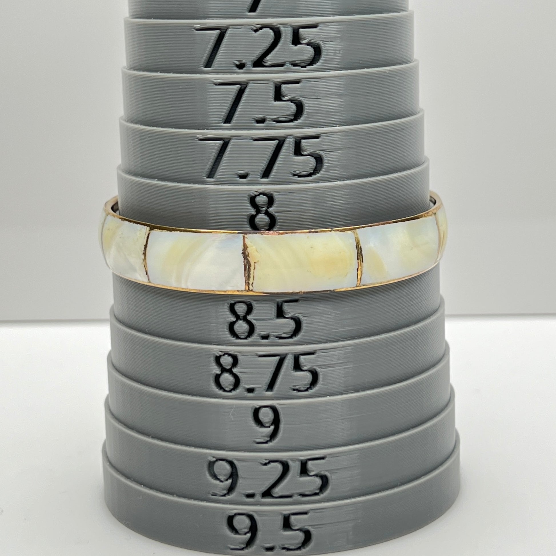 Bracelet shown on sizing mandrel at 8.25 inches interior