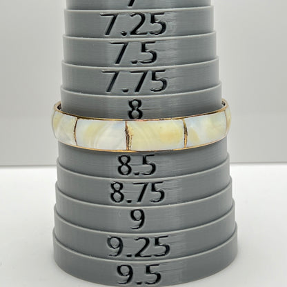 Bracelet shown on sizing mandrel at 8.25 inches interior