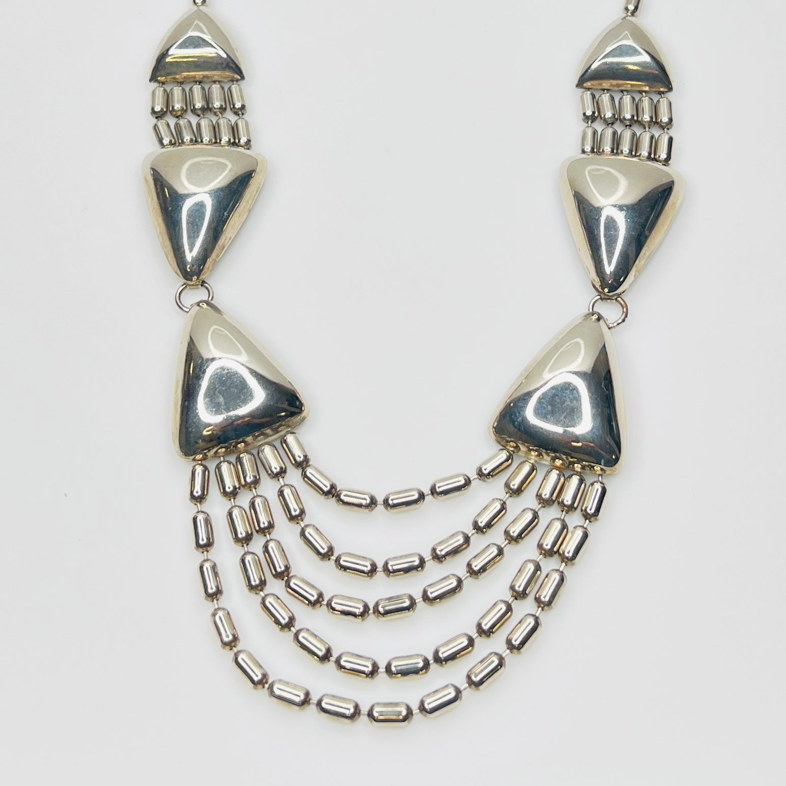 Vintage 1970s stainless steel geometric statement necklace with draped chain bib