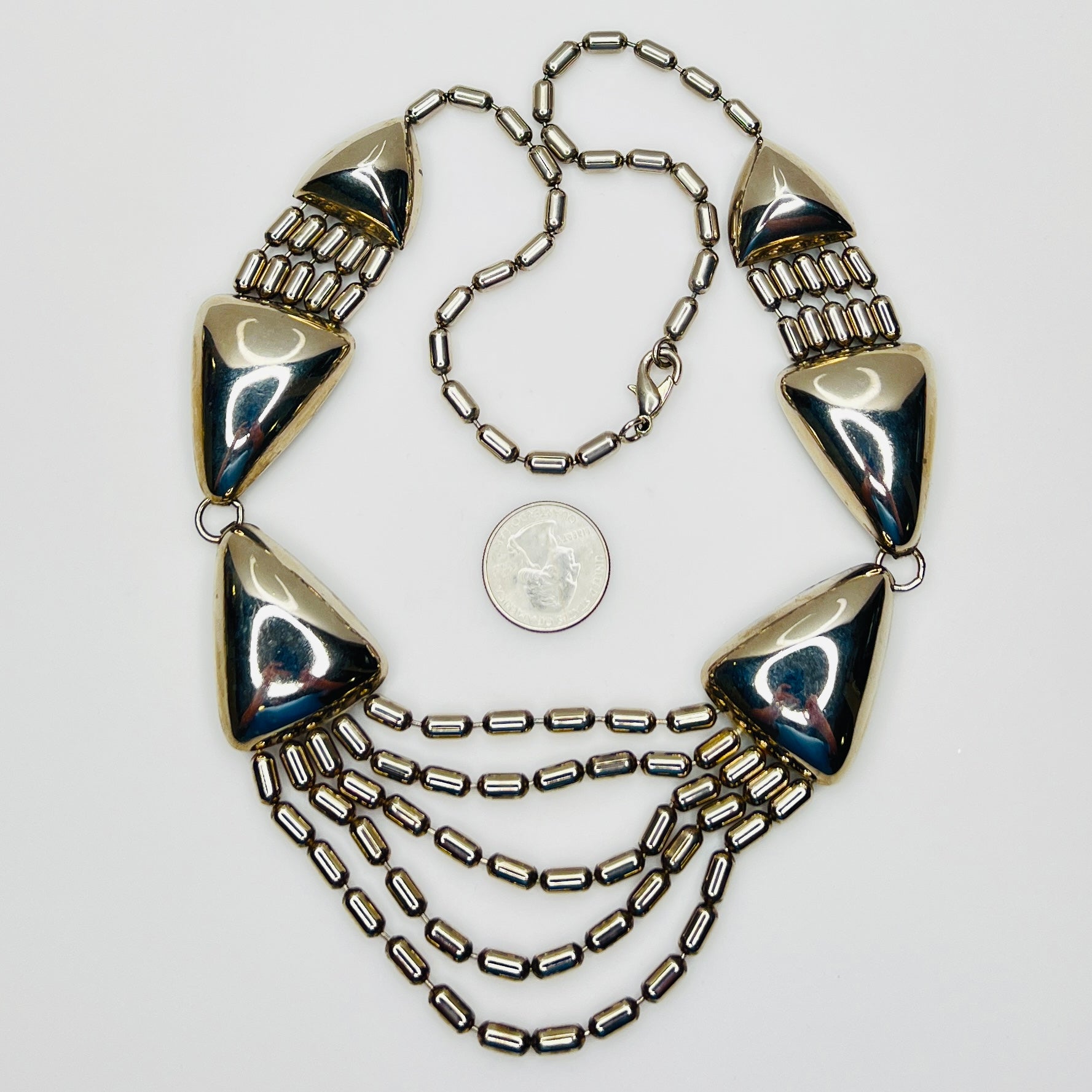 Vintage 1970s stainless steel geometric statement necklace with draped chain bib