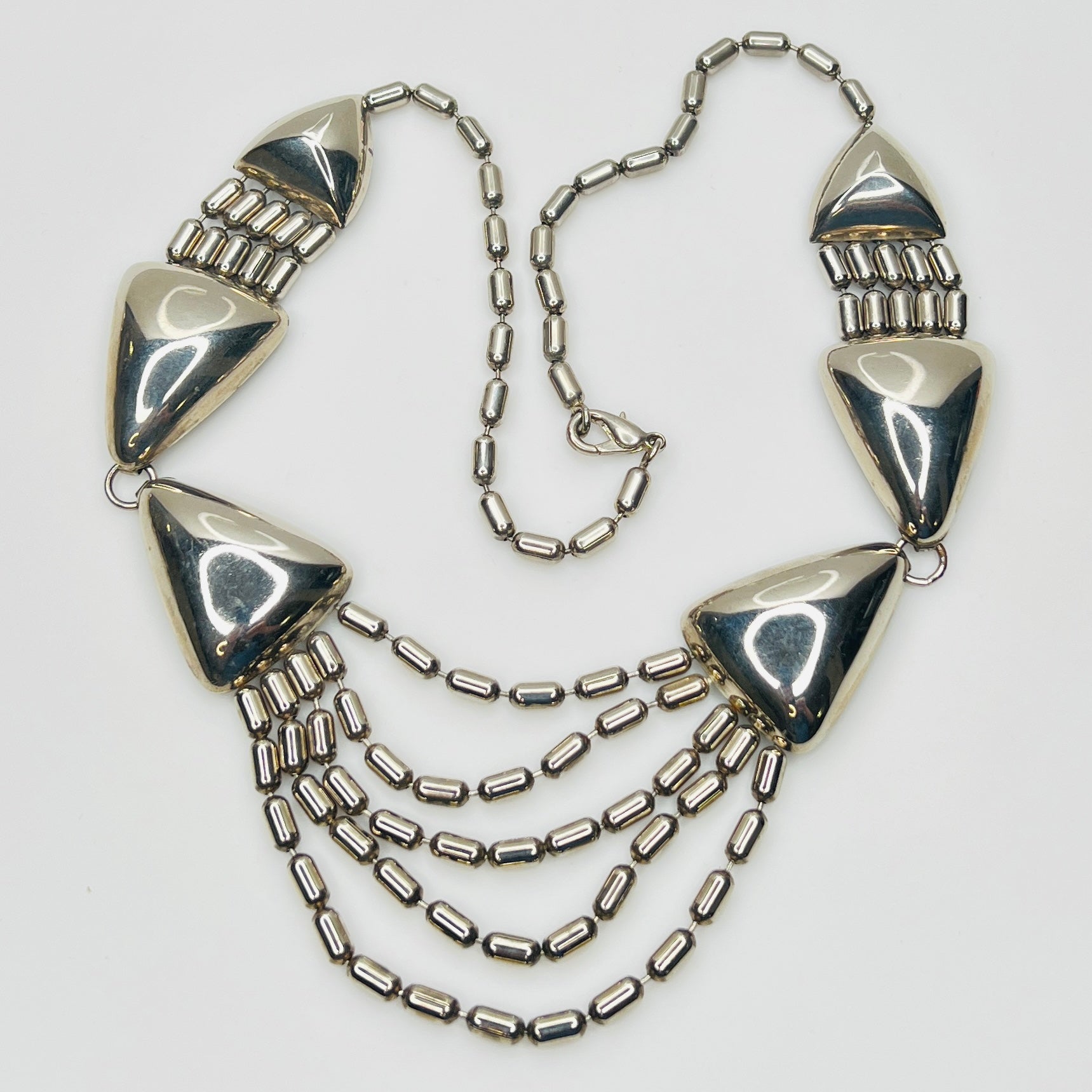 1970s silver tone geometric necklace with triangular links and cascading chains