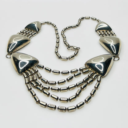 1970s silver tone geometric necklace with triangular links and cascading chains