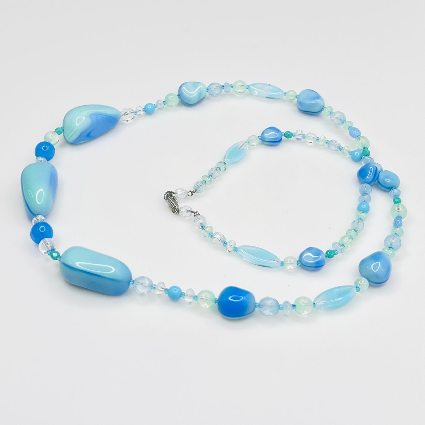 Blue green glass bead necklace with silver tone clasp, 31 inches