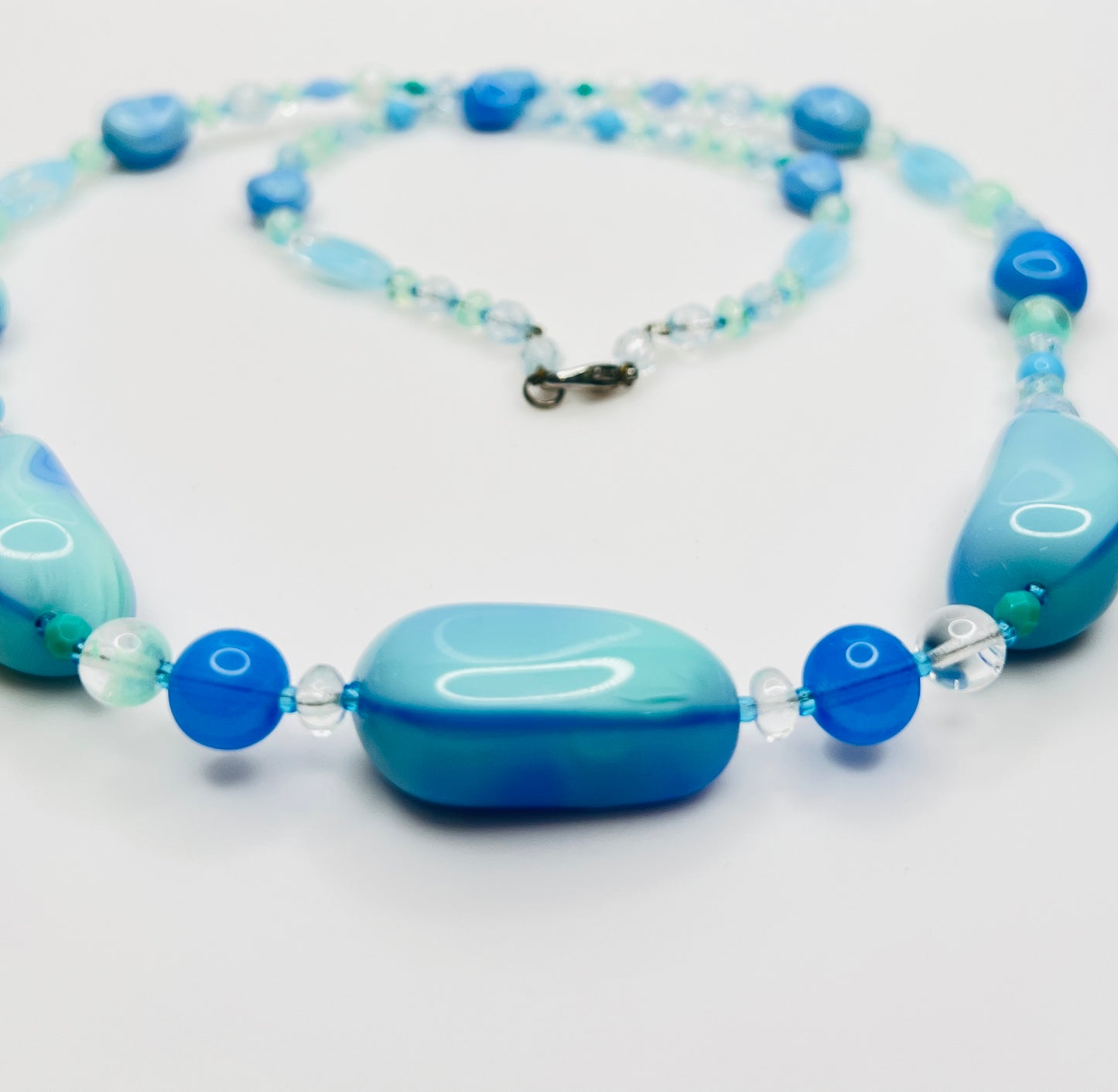 Close-up of aqua and turquoise art glass beads, 1980s necklace