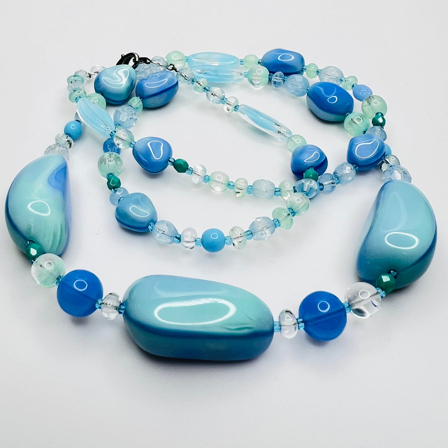 Close-up of aqua and turquoise art glass beads, 1980s necklace