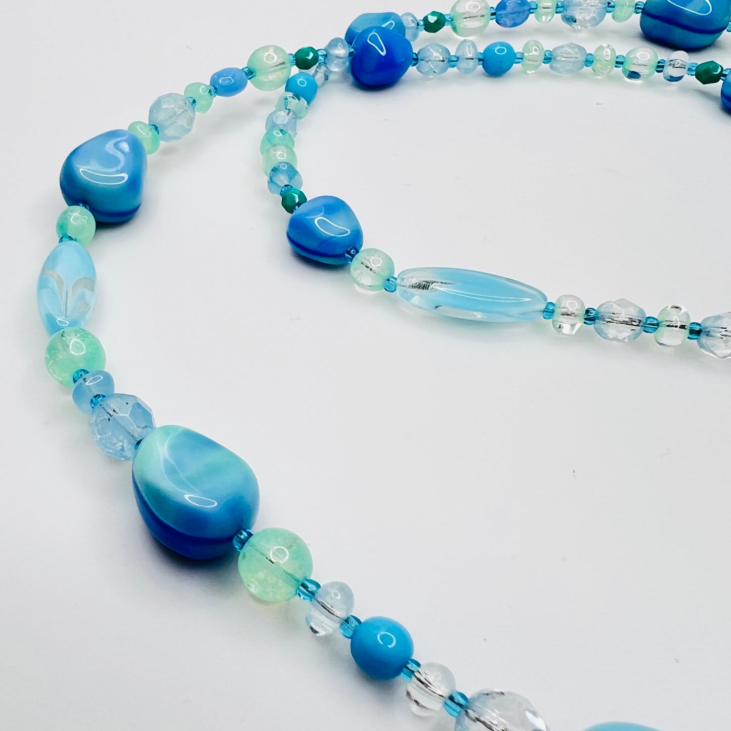 Close-up of aqua and turquoise art glass beads, 1980s necklace