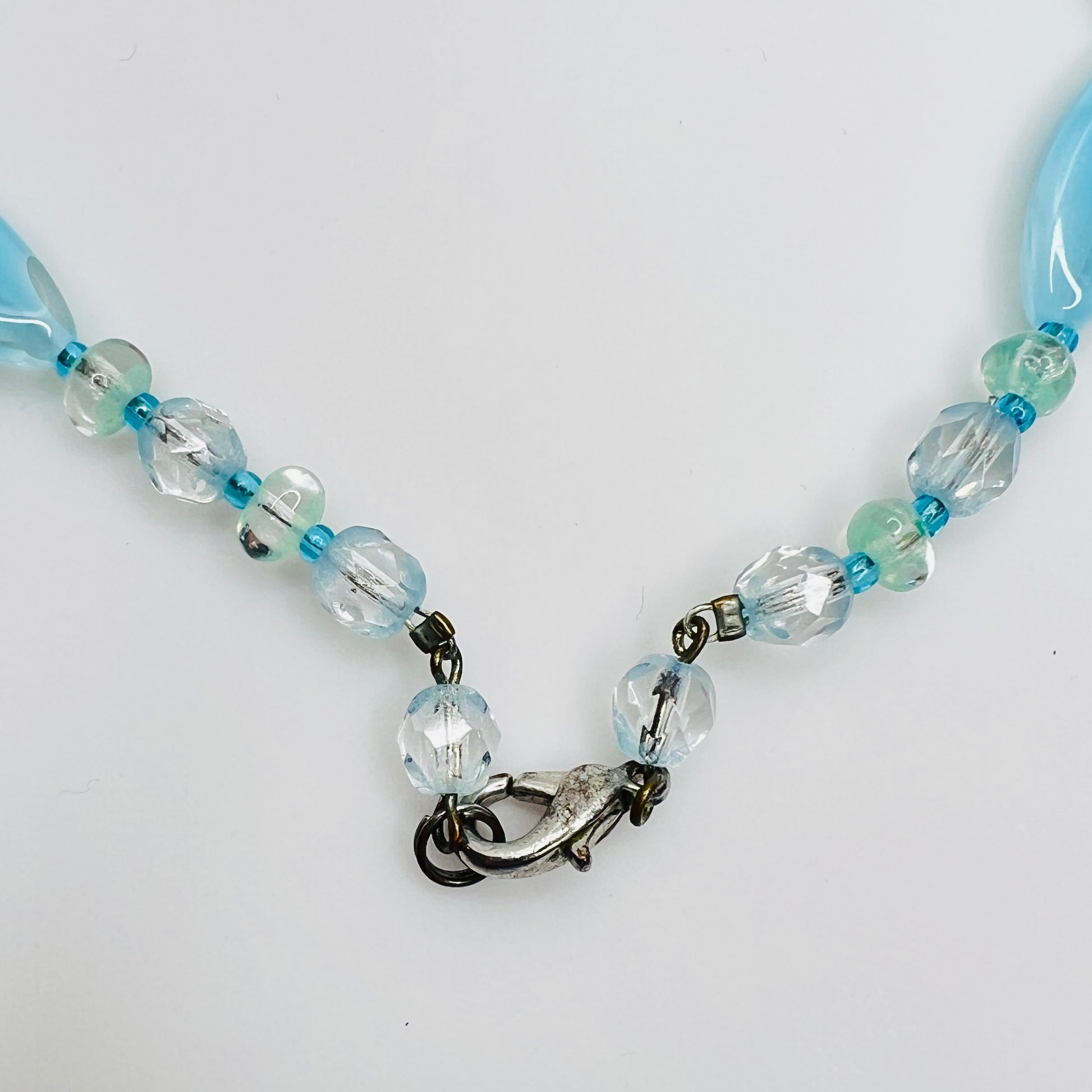 Close-up of aqua and turquoise art glass beads, 1980s necklace