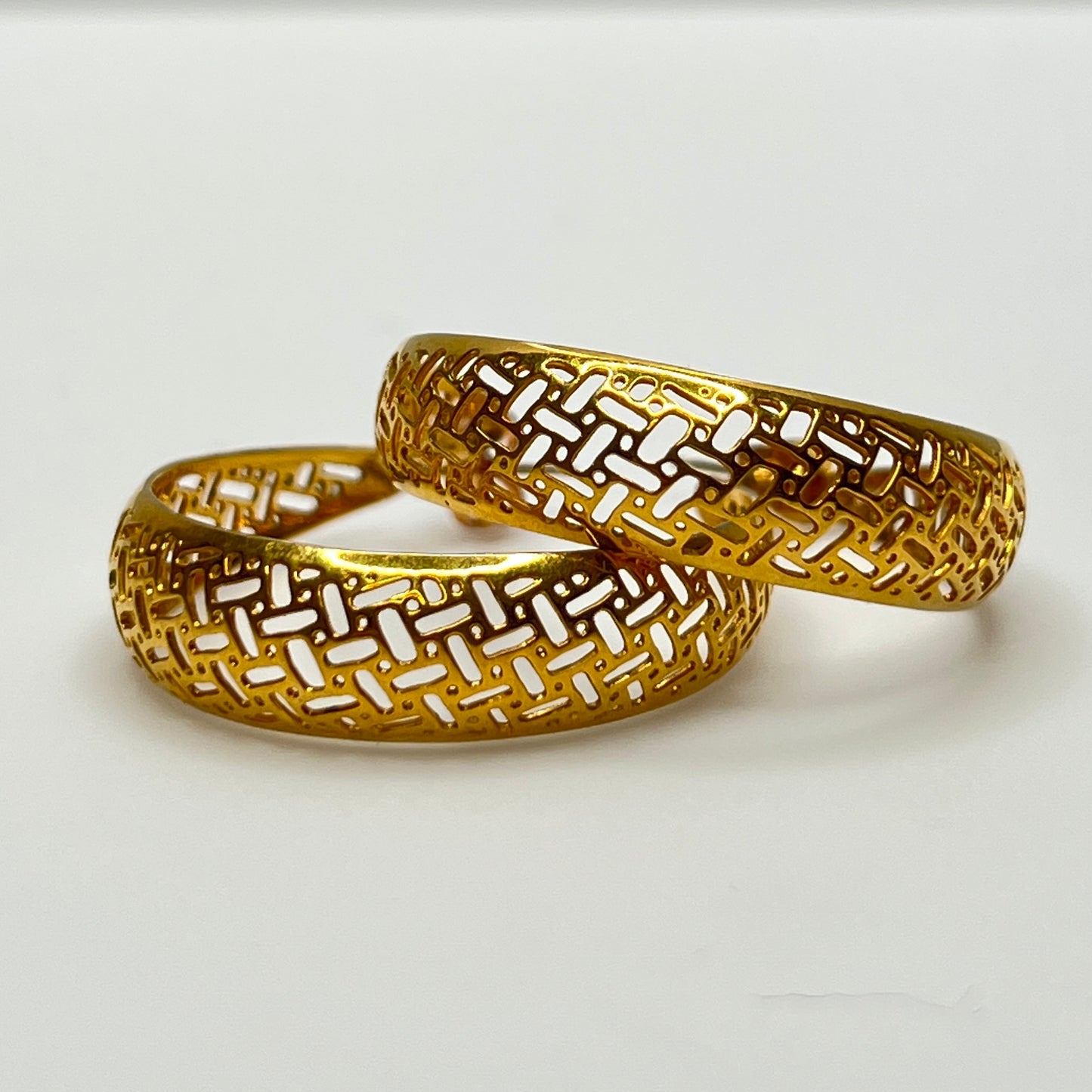 Large vintage gold filigree hoop earrings with open weave pattern