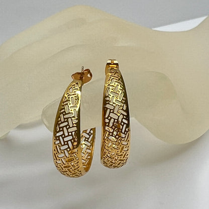 Pair of vintage gold woven statement earrings, close-up