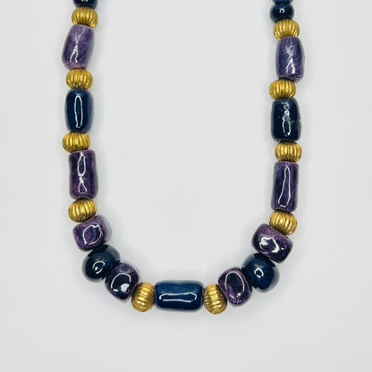 Chunky 1980s ceramic bead necklace in navy and purple with gold tone spacers