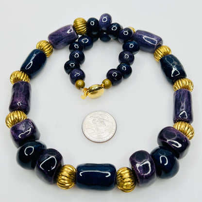 Close-up of gold tone box clasp and glossy ceramic beads, 21 inch necklace