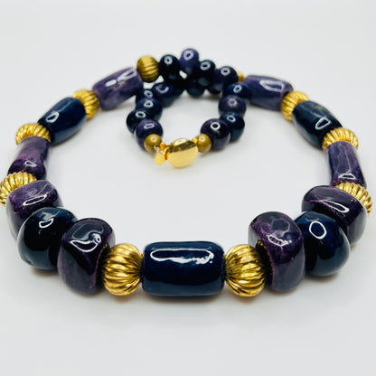 Close-up of gold tone box clasp and glossy ceramic beads, 21 inch necklace