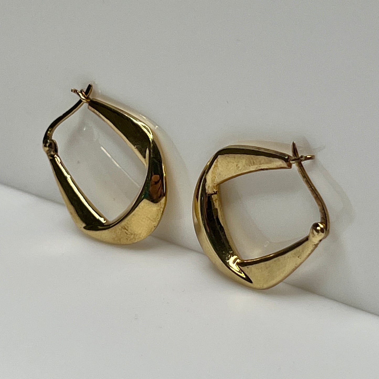 Modernist Danecraft hoop earrings with smooth, curved design