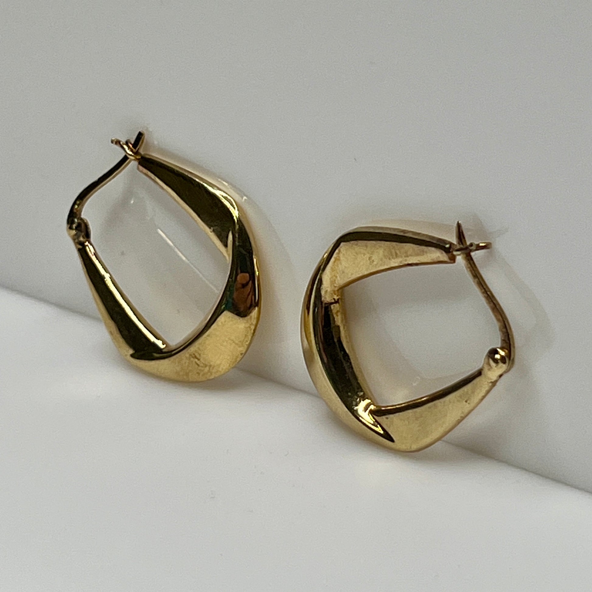 Modernist Danecraft hoop earrings with smooth, curved design