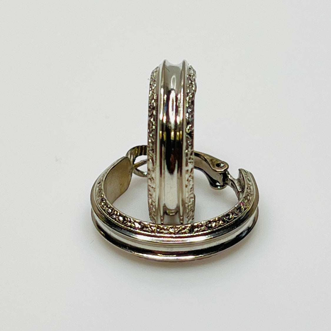 3/4 inch silver-tone hoops with etched detailing