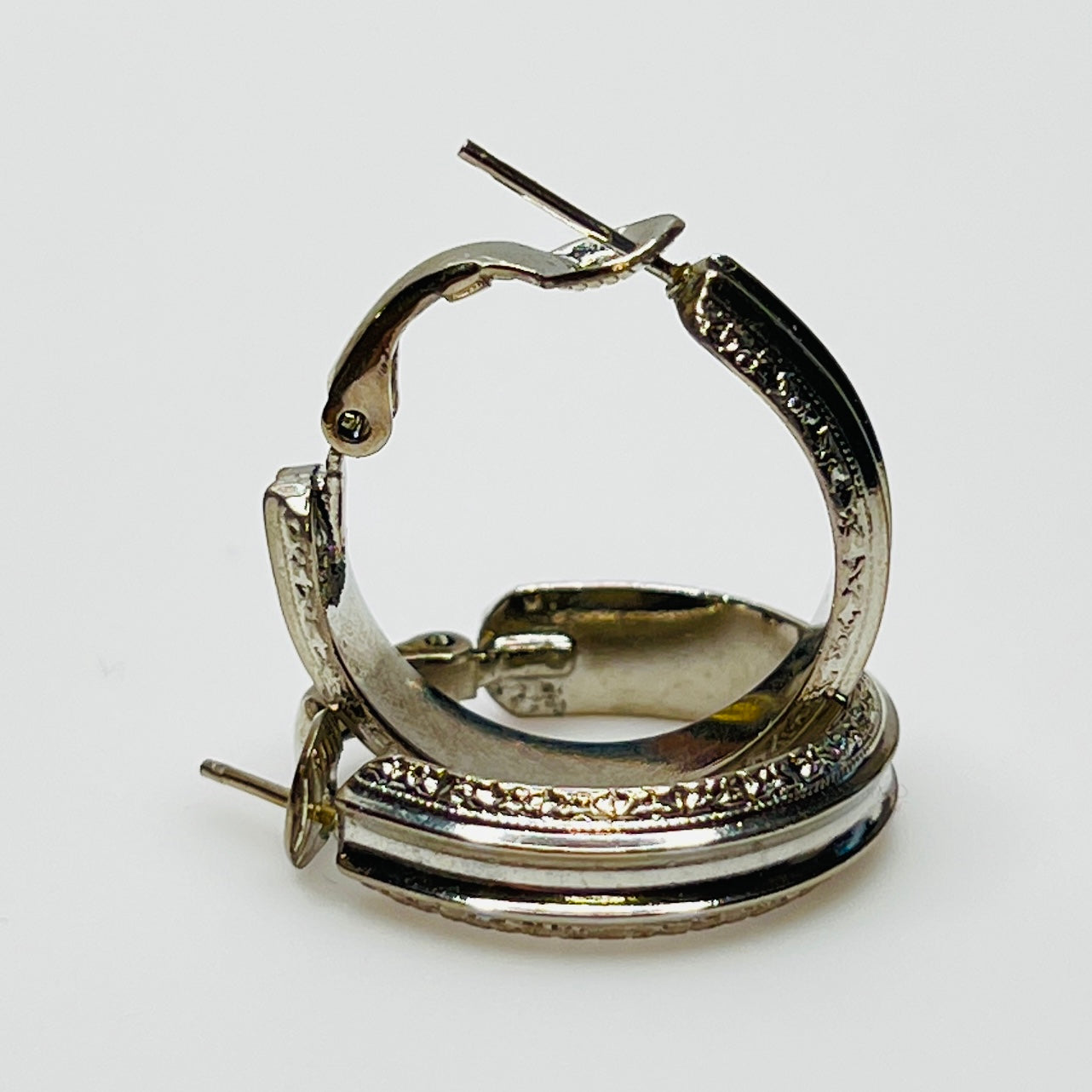 3/4 inch silver-tone hoops with etched detailing