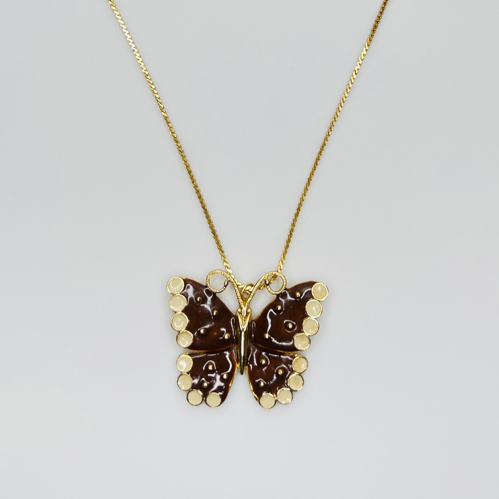 1980s brown enamel butterfly pendant necklace on gold tone chain