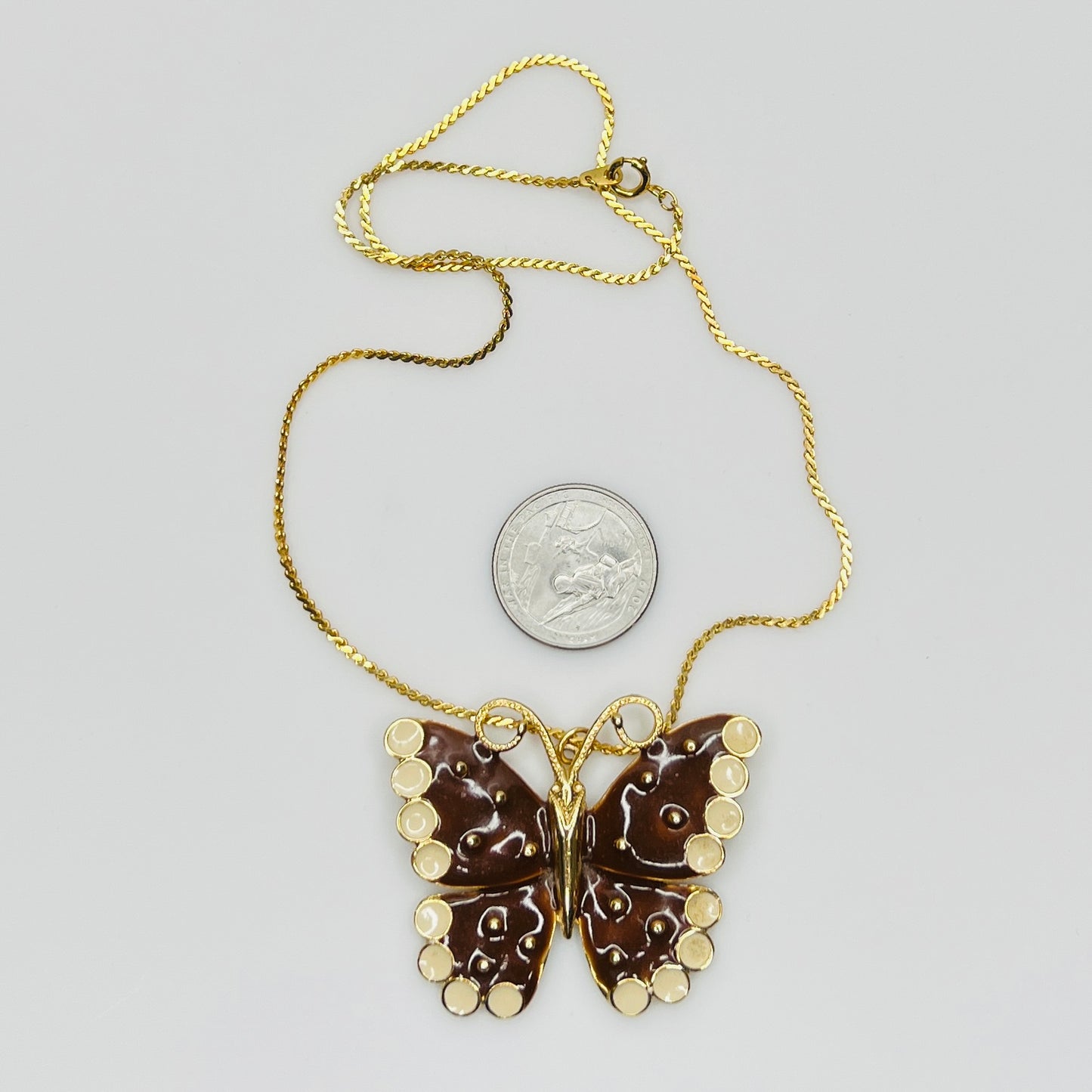 1980s brown enamel butterfly pendant necklace on gold tone chain